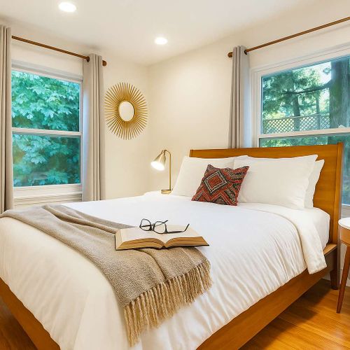 Queen bed with soft light and nearby closet. Easy to settle in and rest.