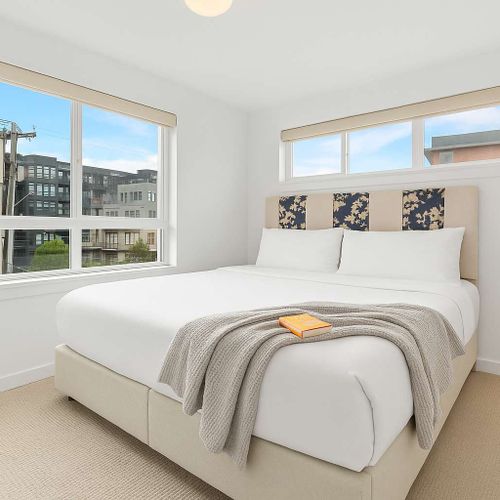 Rest in the queen bed or enjoy soft morning light through the corner windows.