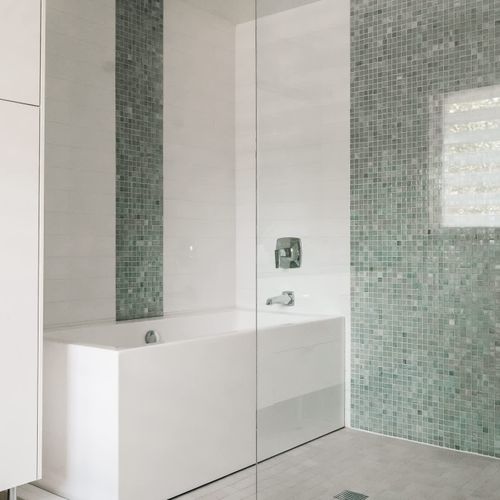 En suite bathroom has large soaking tub