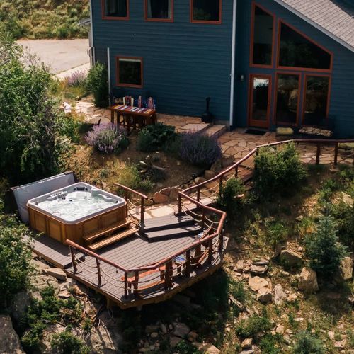 3 patio seating areas with a large hot tub