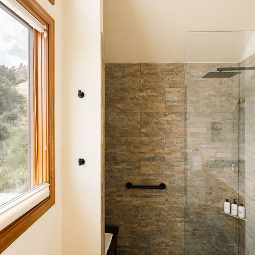 Walk-in glass shower in the primary bathroom