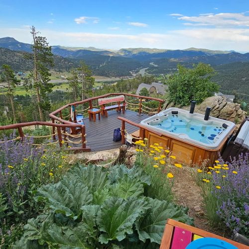 View of the hot tub deck with freshly landscaped garden