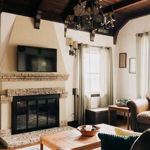 Living room with TV, Sonos speaker, and gas fireplace