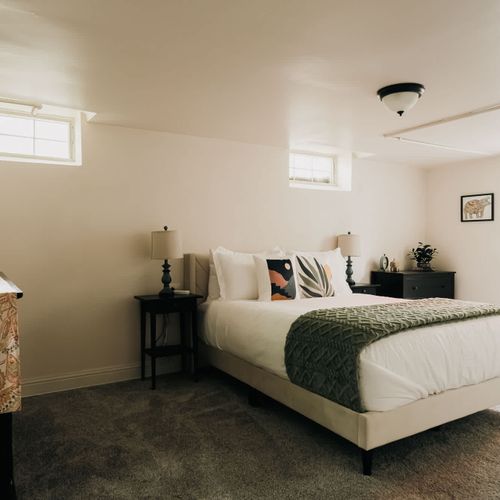 Bedroom 3 in the basement with queen bed
