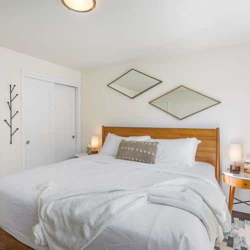 Peaceful bedroom sanctuary with soft linens and a calming ambiance.