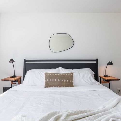 King bed, soft bedding, and gentle light. Settle in and drift off.