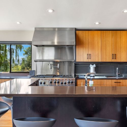 Fully equipped kitchen with stainless steel appliances—ready for your culinary creations.