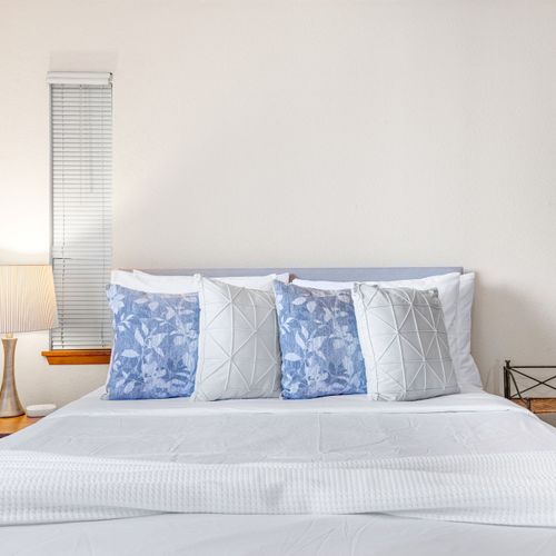 Plush bedding and serene design for the perfect night’s rest.