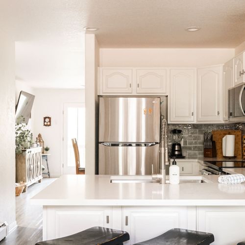 Open kitchen with bar-style seating at the kitchen counter