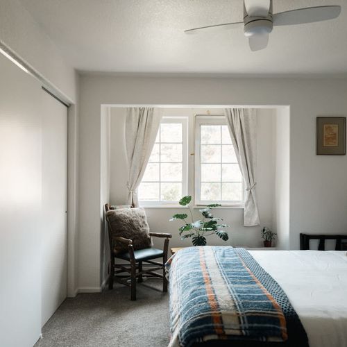 Primary bedroom with queen bed, smart TV, plus a full, private ensuite bathroom