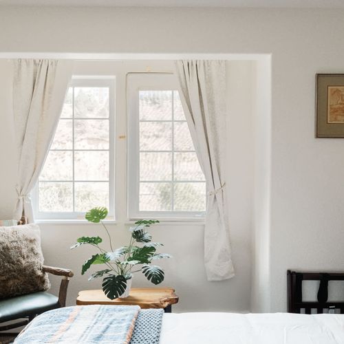 Primary bedroom with queen bed, smart TV, plus a full, private ensuite bathroom