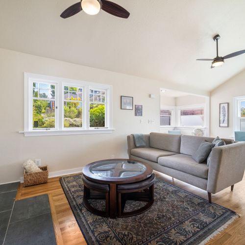 Comfortable living area with natural light and flexible seating.