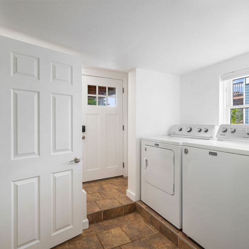 Laundry room with washer and dryer for extended stays.