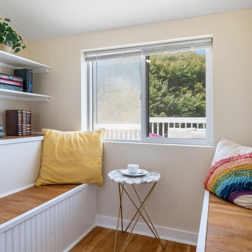 Reading nook in the primary bedroom — the perfect book spot.