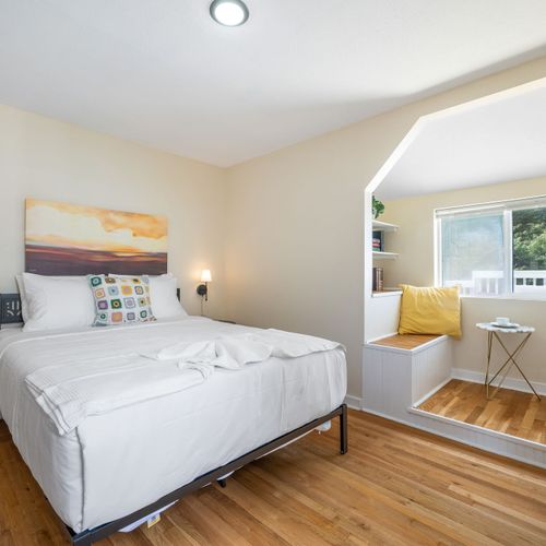 Main level bedroom with Queen bed and clean design.