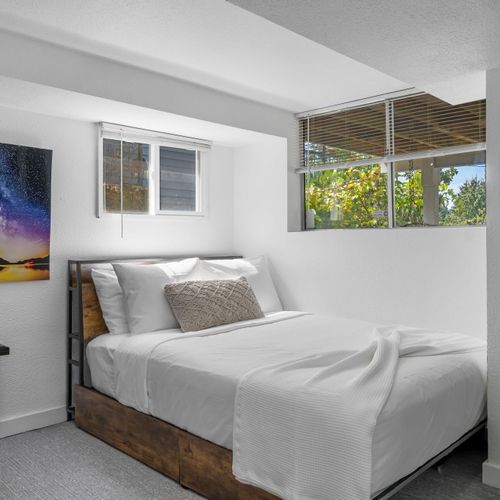 Bedroom #3, with twin and double beds.