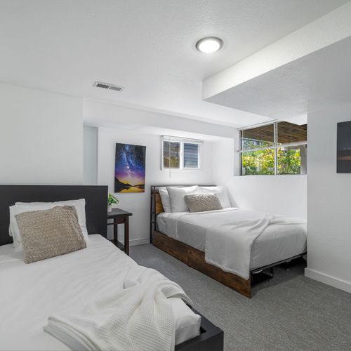 Bedroom #3, with twin and double beds.