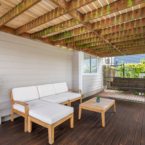 Lower deck with cushioned seating and shaded retreat.
