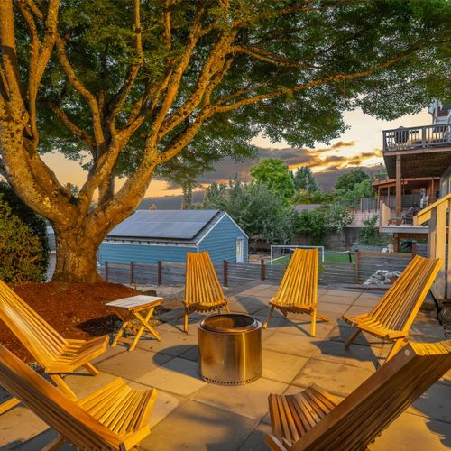 Evening glow from the backyard fire pit area, tucked into the trees.
