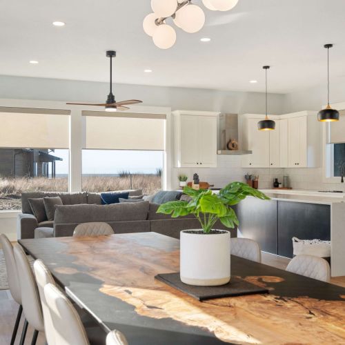 Full view of living space, with ocean views, full kitchen, and seating for your whole group.