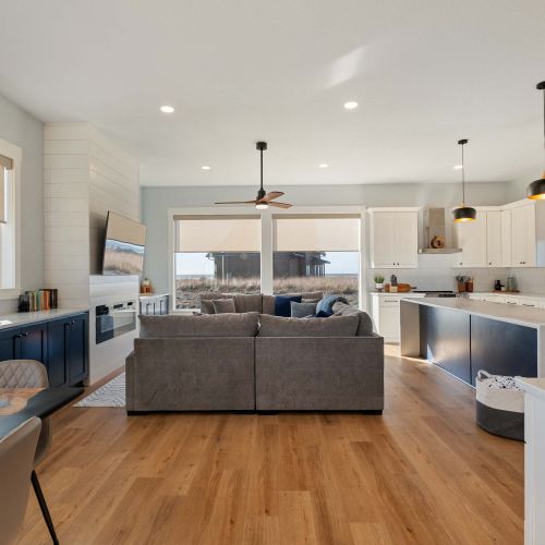 Full view of living space, with ocean views, full kitchen, and seating for your whole group.