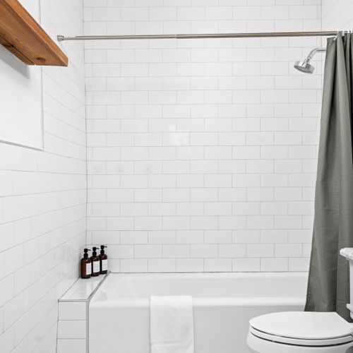 Shower tub combo with modern marble tile flooring!
