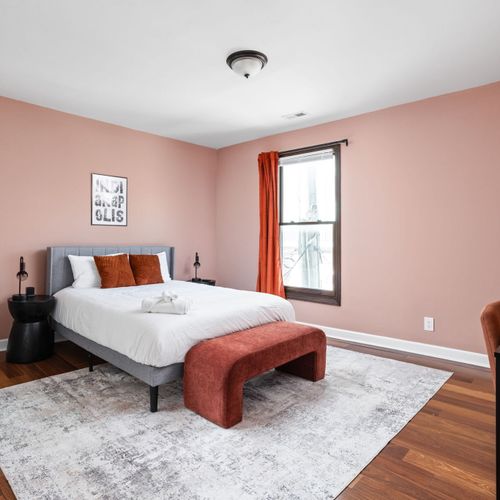 Pretty in pink - this cozy queen room with Indy inspired touches is the perfect city hideaway.
