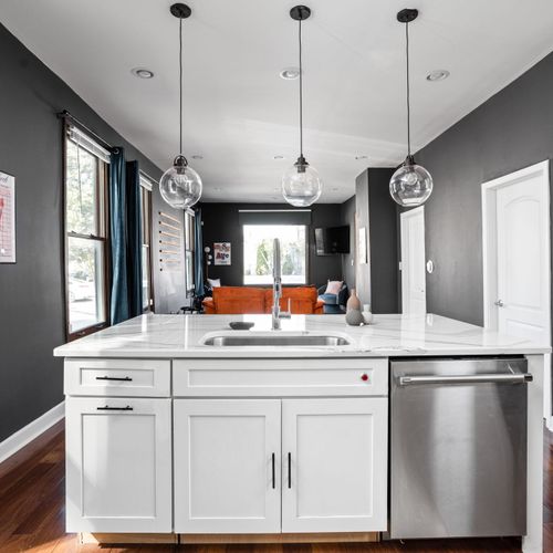 Sleek chef’s kitchen with modern finishes and a stylish breakfast bar