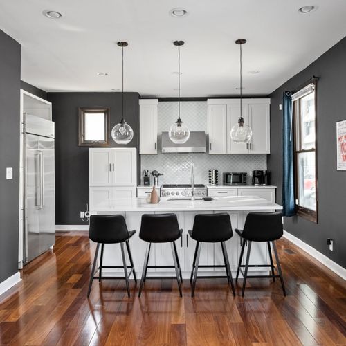 Sleek chef’s kitchen with modern finishes and a stylish breakfast bar