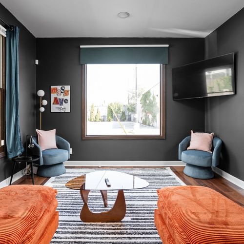 Chic and cozy living space just steps from Mass Ave — modern design, bold colors, and the perfect spot to unwind.