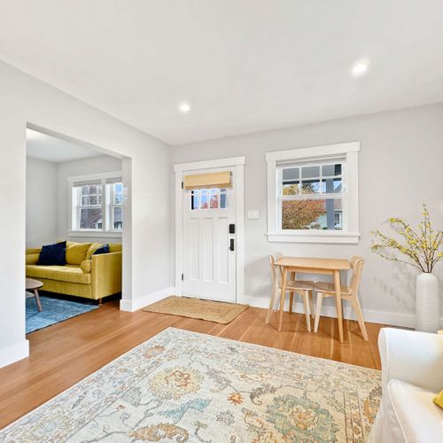 Bright and spacious living room with cozy seating.
