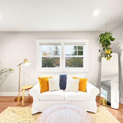 Bright and spacious living room with cozy seating.