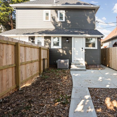 Backyard: Parking Pad and walkway to back entrance!