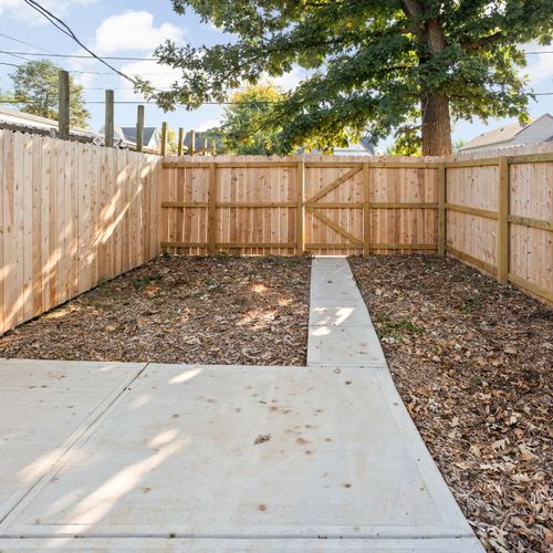 Backyard: Parking Pad and walkway to back entrance!