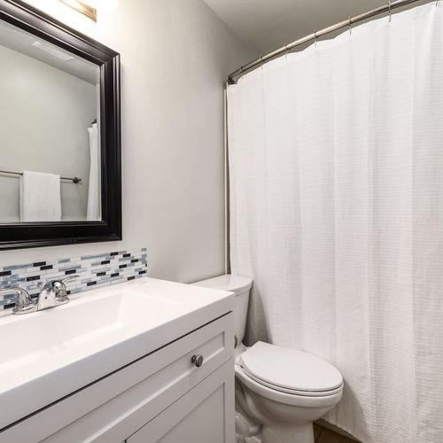 Primary full ensuite private bathroom with tub/shower combo