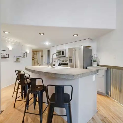 Kitchen island has 4 barstools