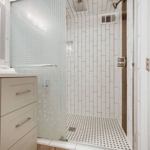 Full bathroom has a large walk-in shower