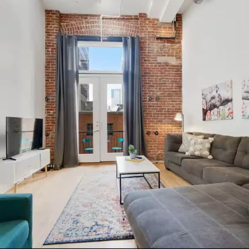 Living room with exposed brick