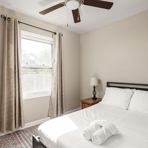 Full Bed with a ceiling fan and nightstand!
