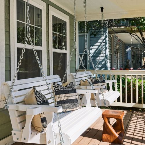 Front porch sittin’ made better with double swings and endless Indy charm.