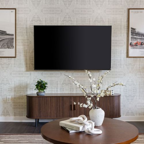 Step into our sleek and sophisticated living space with a touch of Indy flair.