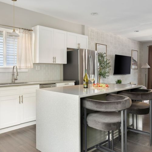 Modern design meets everyday comfort in this inviting kitchen.