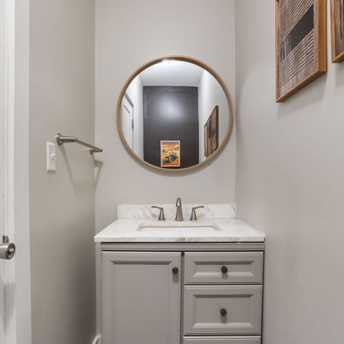 Stylish and convenient half bath just off the kitchen and backyard!