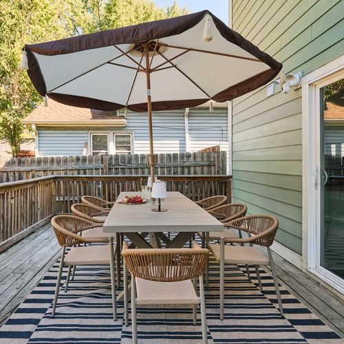 Dine outdoors under the umbrella — perfect for sunny Indy days.