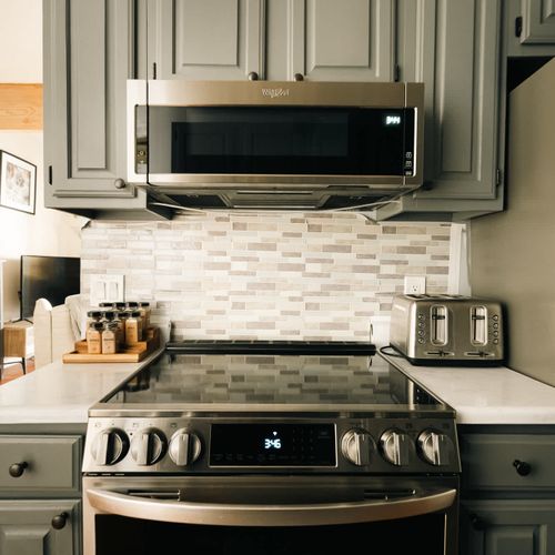 Open kitchen with all stainless-steel appliances