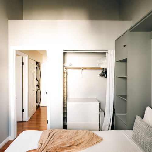 Bedroom 2 with a queen bed and storage