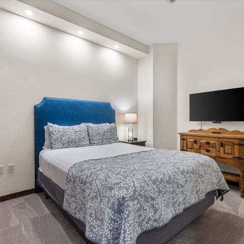 Bedroom 2 with queen bed and Roku TV