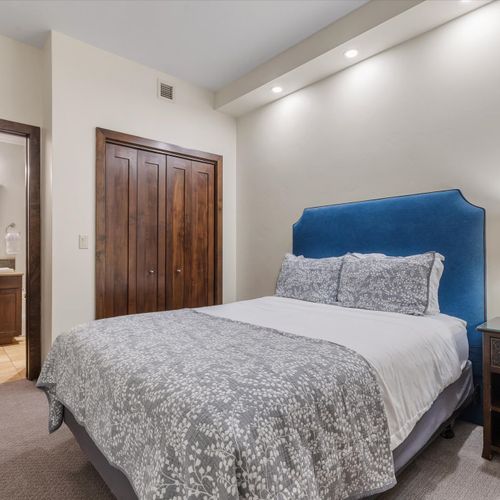 Bedroom 2 with queen bed and en suite bathroom