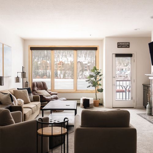 Living area with electric fireplace and TV