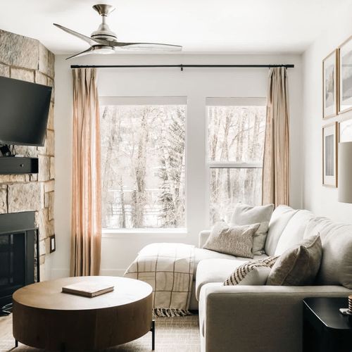 Living area seating, fireplace, and TV